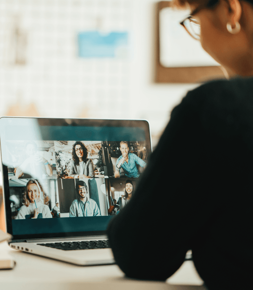 Woman collaborates remotely with the team using seamless video conferencing integration on the laptop.